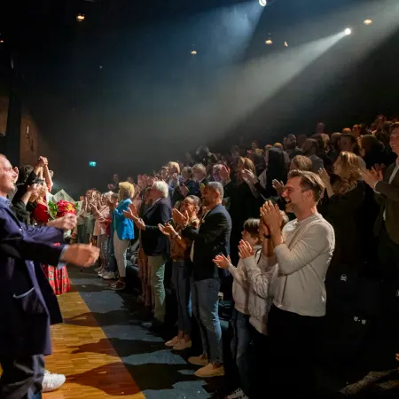 The crowd of Magic World clapping